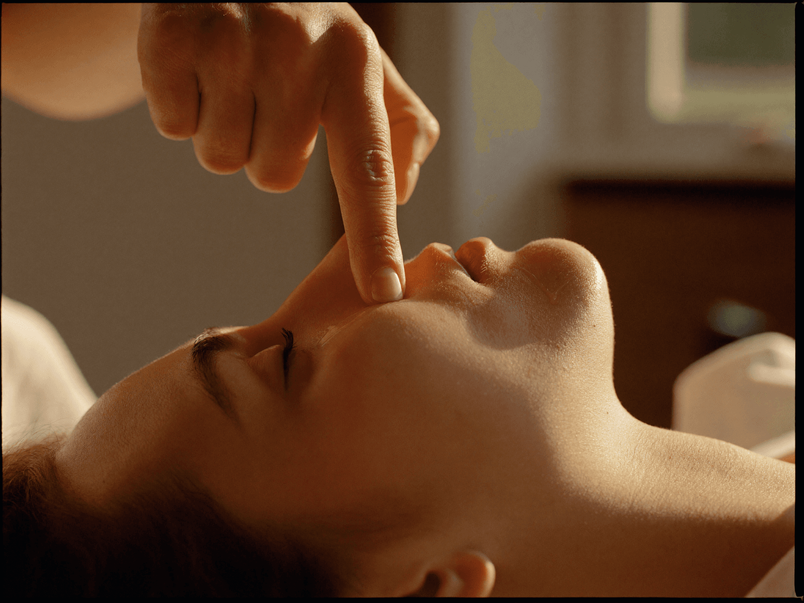 Aesthetician performing a facial massage